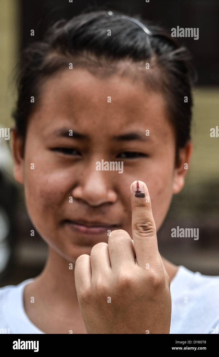 Dimapur, India. 9th Apr, 2014. A Naga woman shows her ink-marked finger after casting her vote during the second phase of Lok Sabha election in Dimapur, India north eastern state of Nagaland on Wednesday, April 09, 2014. India began voting on April 7 and ends on May 12 where hundreds of millions will have cast their ballots to form a new India Government. Credit:  Caisii Mao/NurPhoto/ZUMAPRESS.com/Alamy Live News Stock Photo