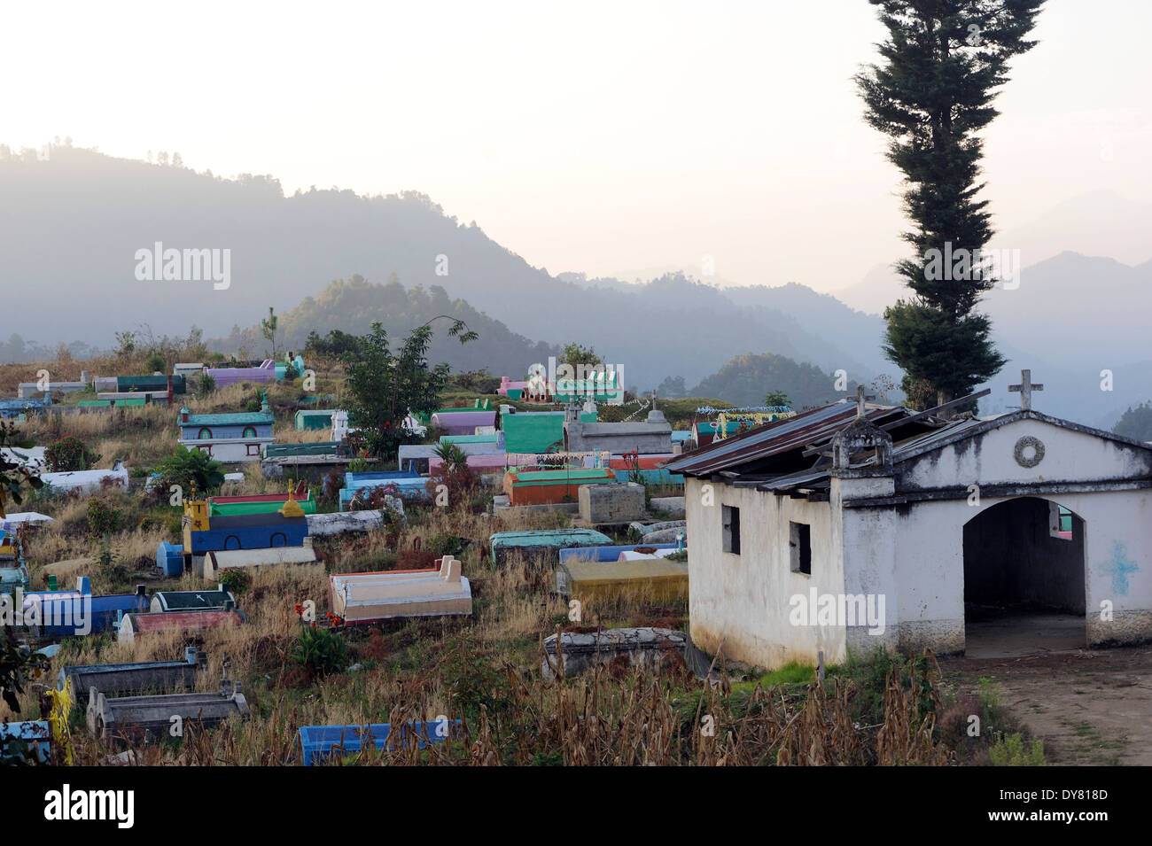 Brightly coloured gravestones in the cemetery in Santa Catarina.  Santa Catarina Ixtahuacan, Stock Photo