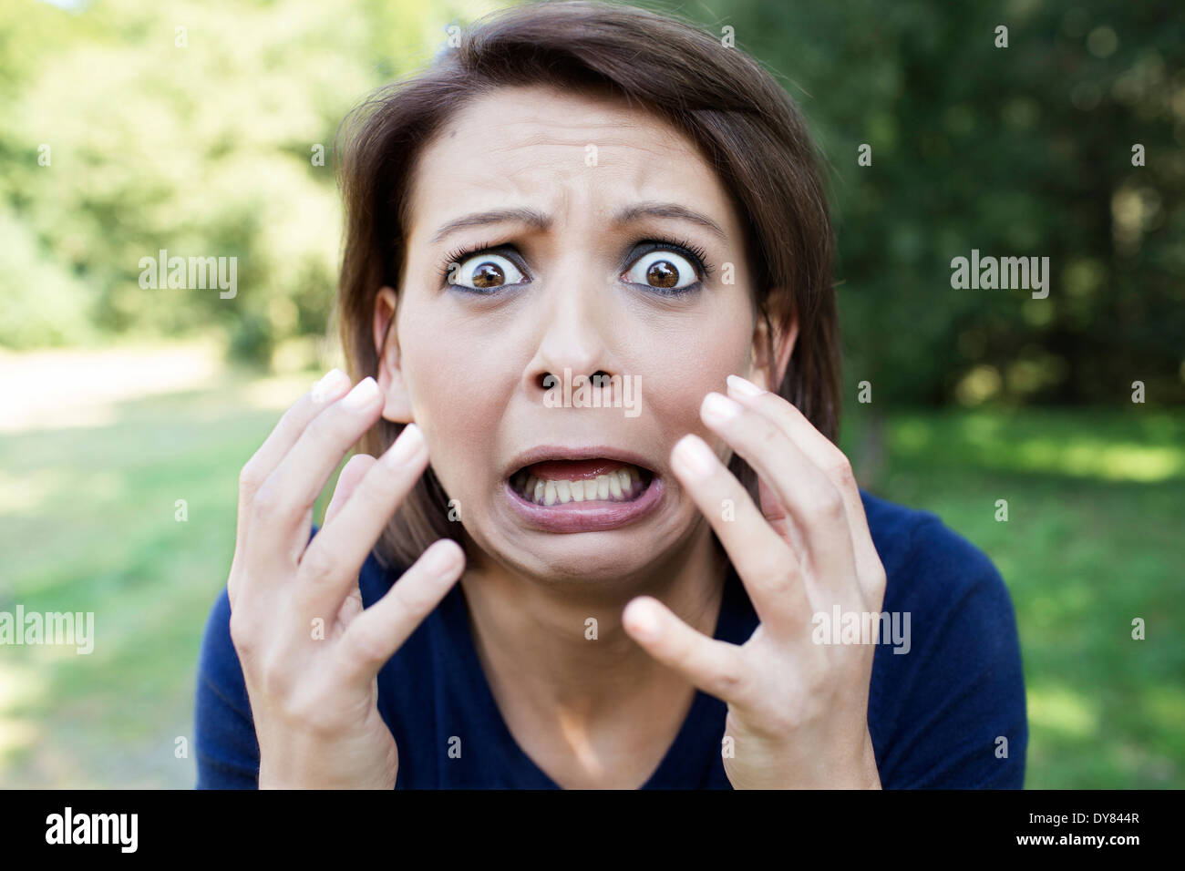 Portrait of horrified woman Stock Photo