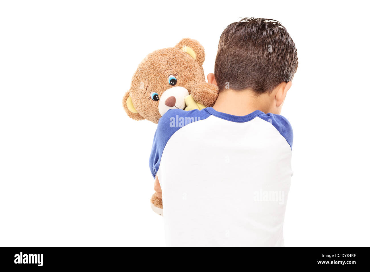 Little boy hugging a teddy bear Stock Photo - Alamy
