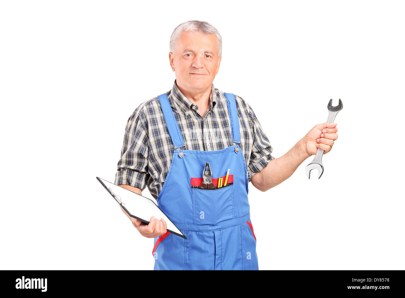 Mature mechanic holding clipboard and a wrench Stock Photo - Alamy