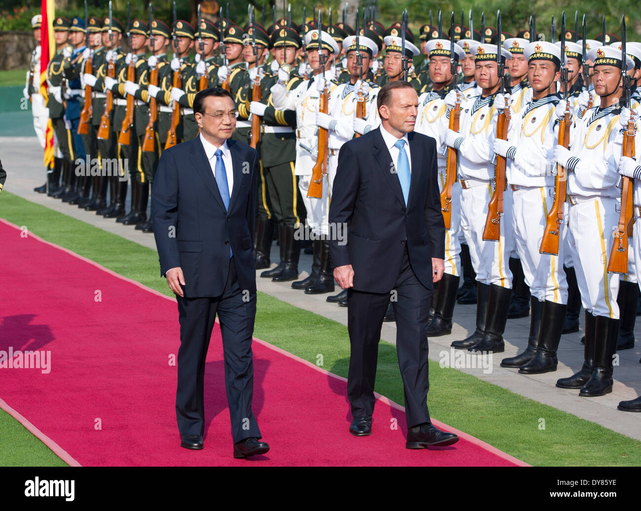Beijing, China's Hainan Province. 9th Apr, 2014. Chinese Premier Li Keqiang (L) and Australian Prime Minister Tony Abbott review the guard of honor at the welcoming ceremony before the annual talks between the two countries' government leaders, in Sanya City, south China's Hainan Province, April 9, 2014. Credit:  Xie Huanchi/Xinhua/Alamy Live News Stock Photo