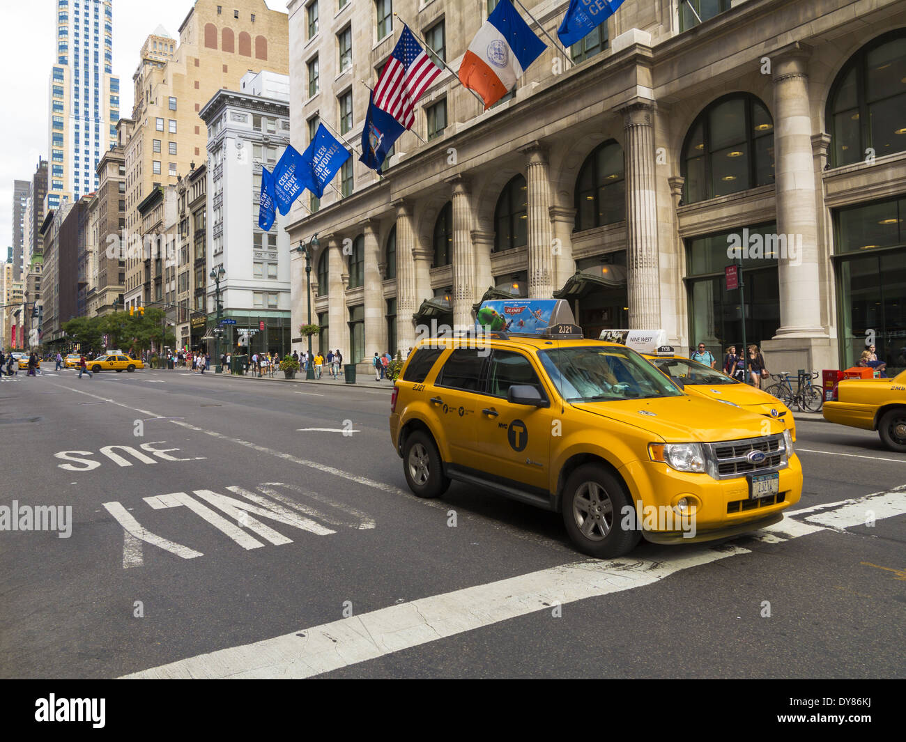 Yellow taxi cab stopped in front of the The Graduate Center New York USA Stock Photo