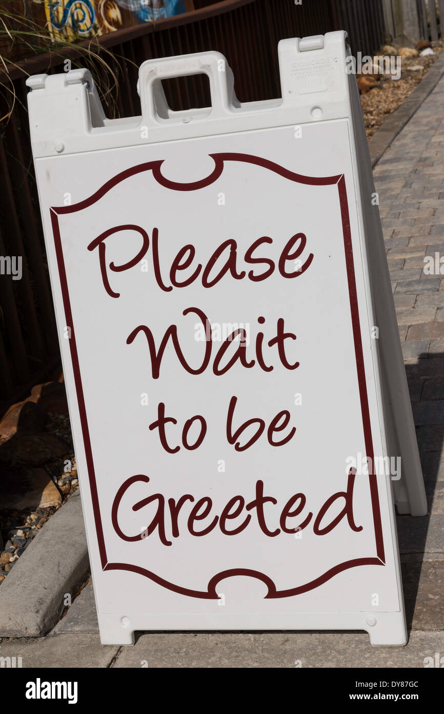 Waterside Restaurant Sign,'Please Wait To Be Seated' Sweet Water, FL USA Stock Photo