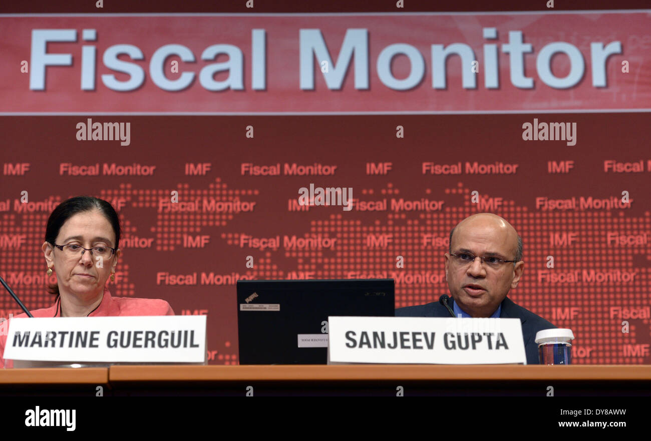 Washington, DC, USA. 9th Apr, 2014. Sanjeev Gupta (R), acting Director of the Fiscal Affairs Department of the International Monetary Fund (IMF), speaks at a press conference releasing the Global Financial Stability Report in Washington, DC, the United States, April 9, 2014. Global fiscal risks are abating somewhat but remain elevated, and underlying fiscal vulnerabilities have increased in emerging market economies during the past year, said the IMF on Wednesday in the newly-released report. Credit:  Yin Bogu/Xinhua/Alamy Live News Stock Photo
