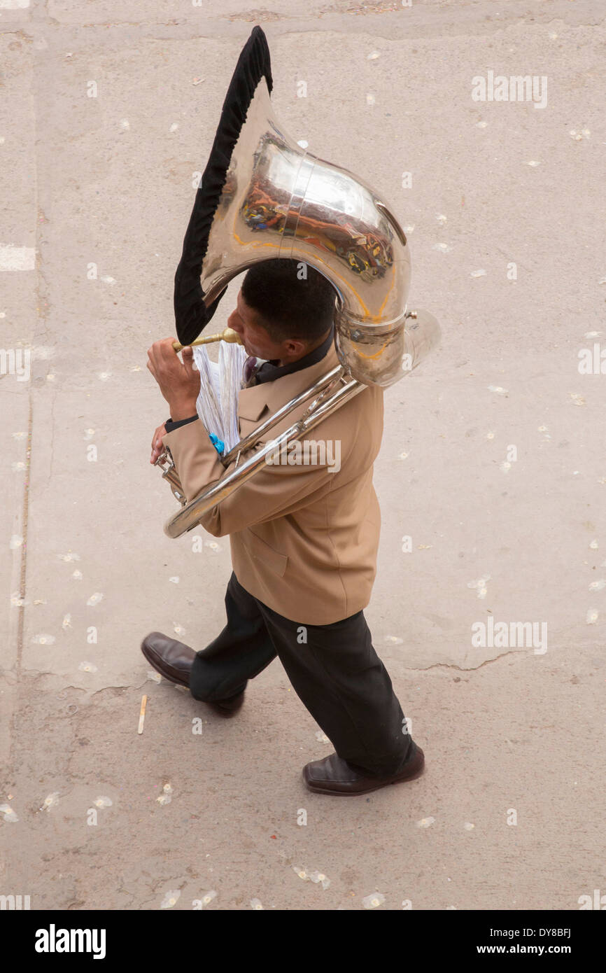 South America, Peru, Calca, man with trumpet at Assumption of the Virgin festival in August, from above Stock Photo