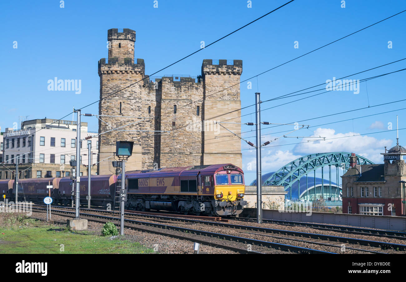 EWS coal train passes Newcastle keep or castle, approaching the Central station north east England UK Stock Photo