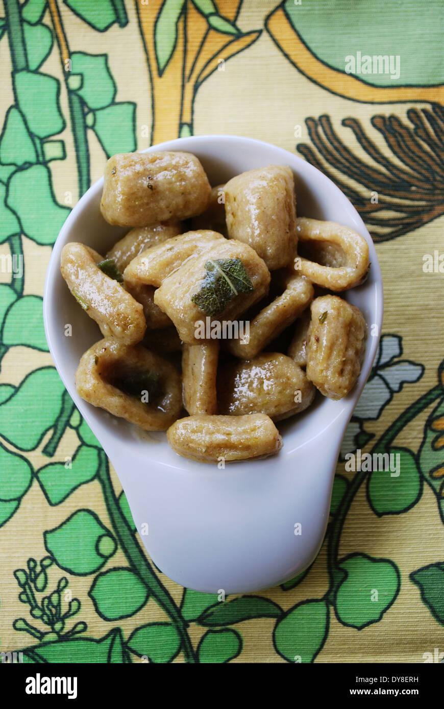 Homemade cooked gnocchi pasta with whole wheat flour served with olive