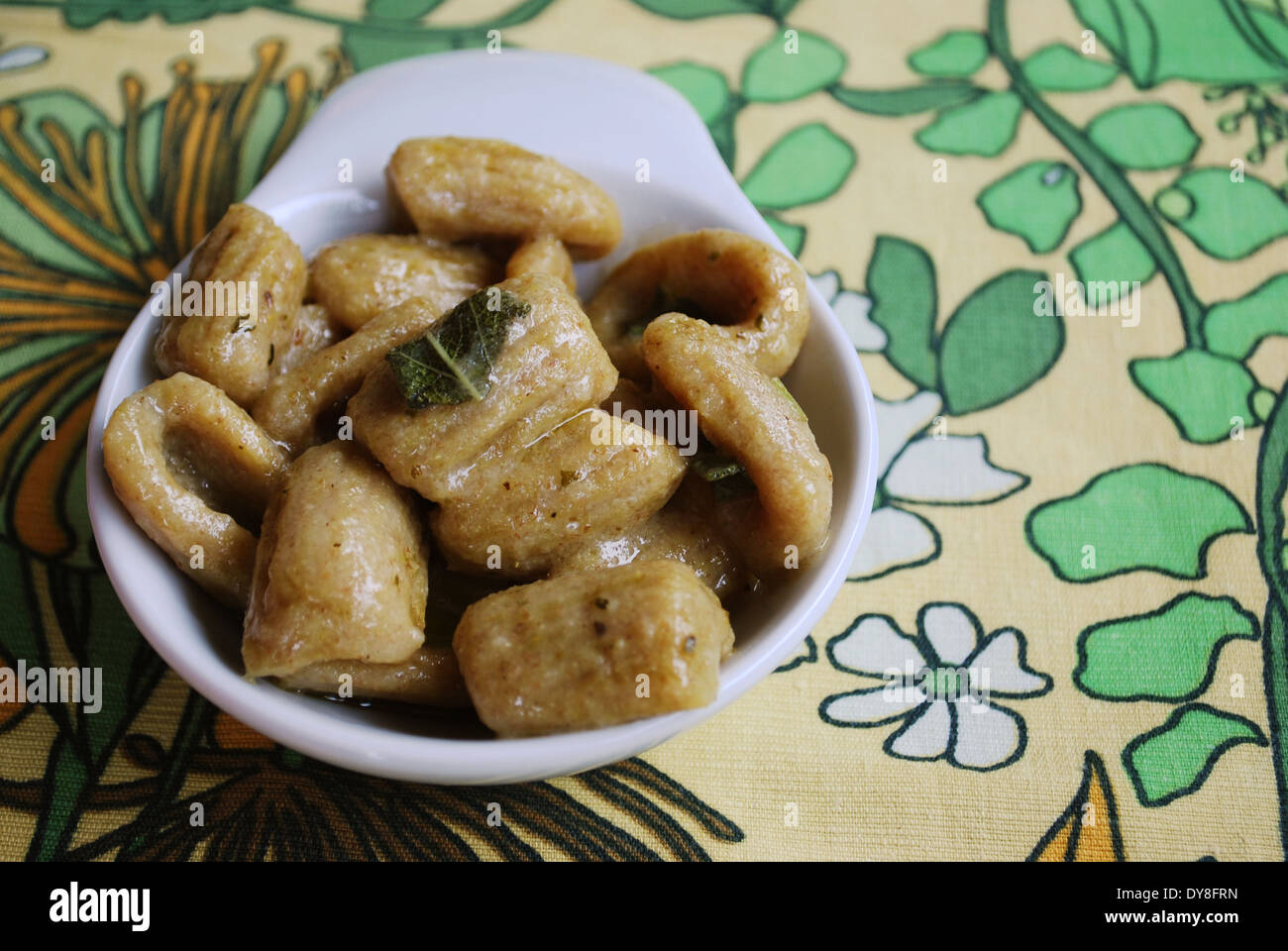 Homemade cooked gnocchi pasta with whole wheat flour served with olive