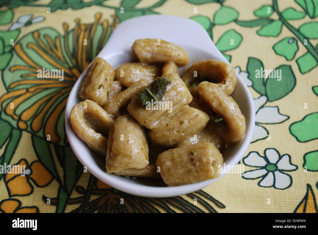 Homemade cooked gnocchi pasta with whole wheat flour served with olive