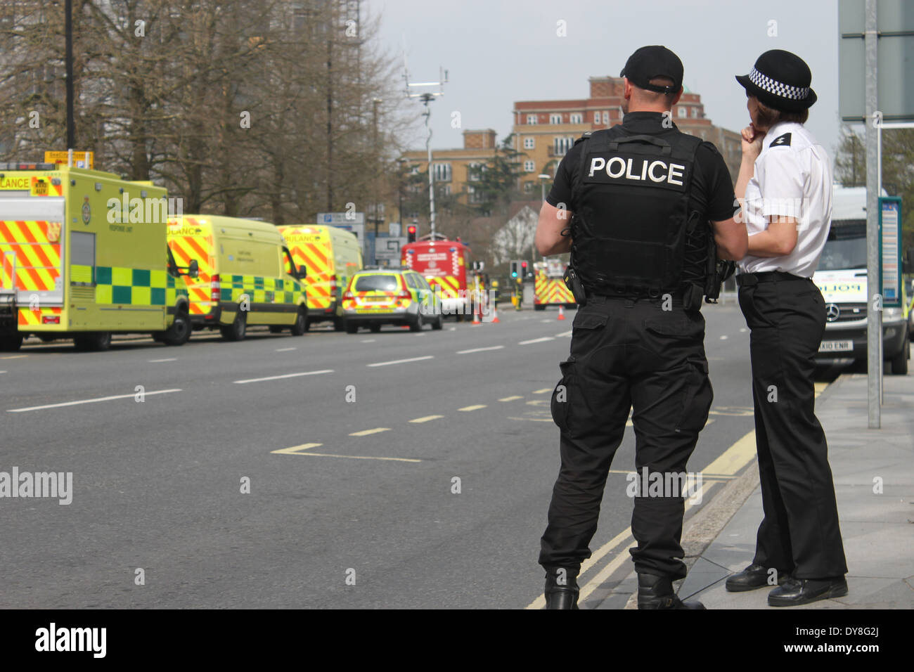 Police Officers look on at a fire scene Stock Photo