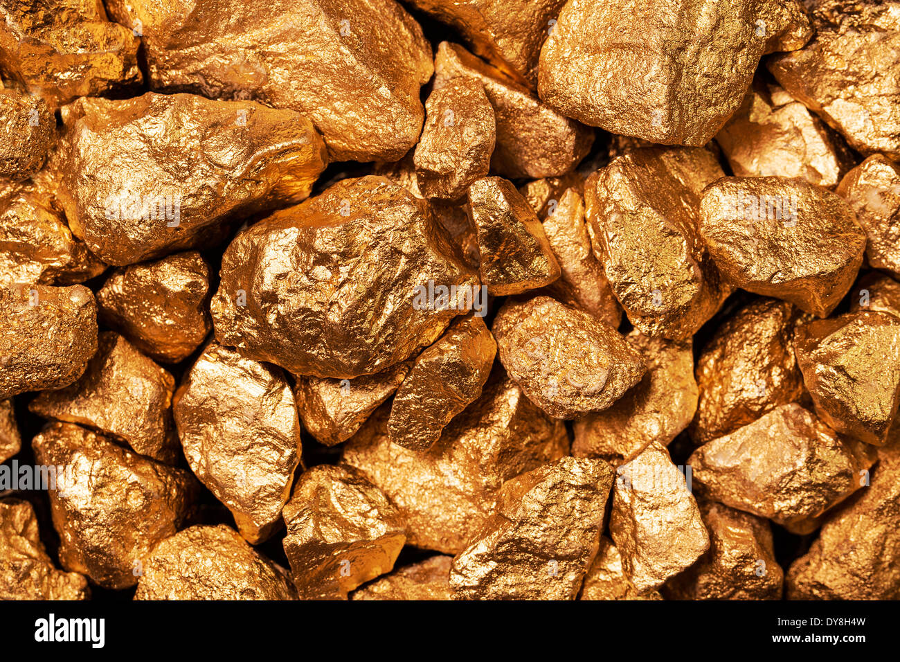 Golden nuggets closeup. Background textured. Stock Photo