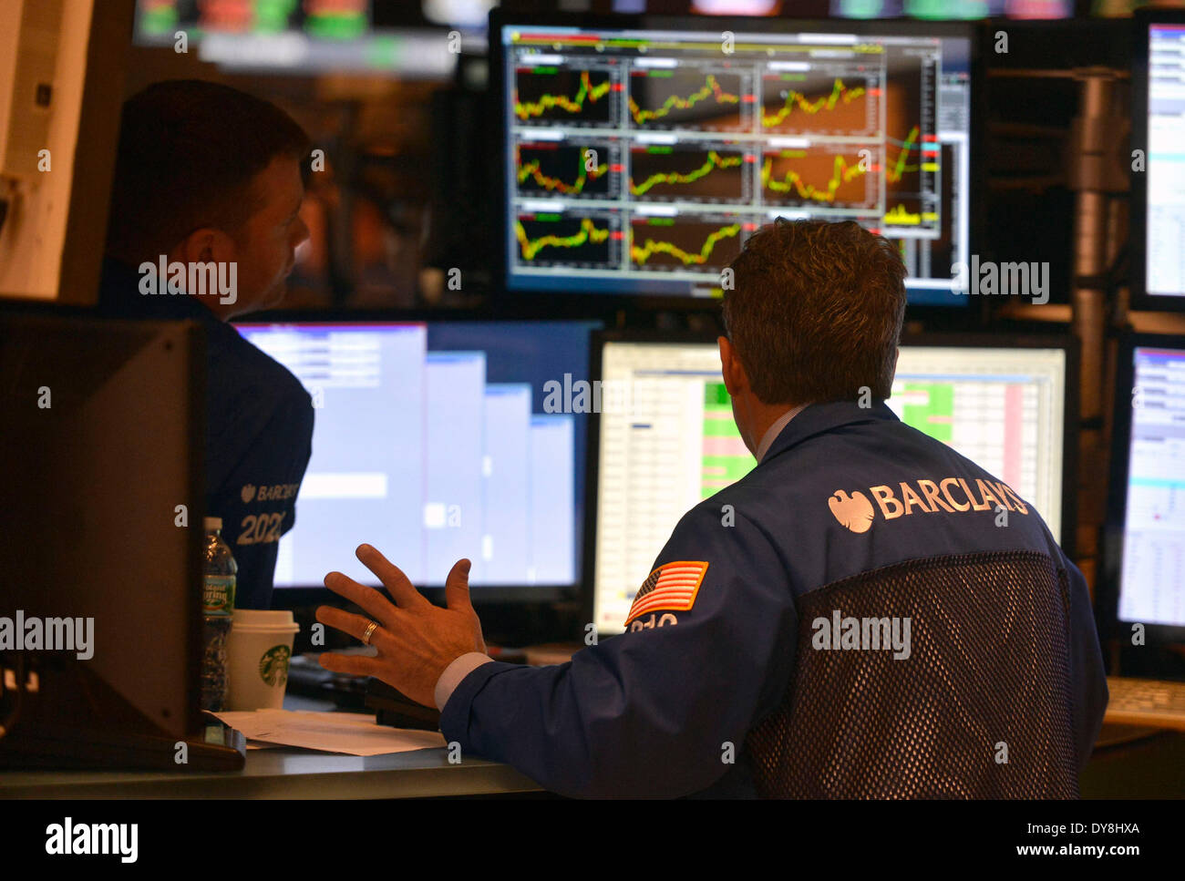 New York, USA. 9th Apr, 2014. Traders work at the New York Stock Exchange in New York, April 9, 2014. U.S. stocks continued to rebound Wednesday, with major stock indices jumping over 1 percent, as market concerns over interest rate hike were eased somewhat by the minutes of the Federal Reserve's latest policy meeting. The Dow Jones Industrial Average surged 181.04 points, or 1.11 percent, to 16,437.18. The S&P 500 soared 20.22 points, or 1.09 percent, to 1,872.18. The Nasdaq Composite Index climbed 70.91 points, or 1.72 percent, to 4,183.90. © Wang Lei/Xinhua/Alamy Live News Stock Photo