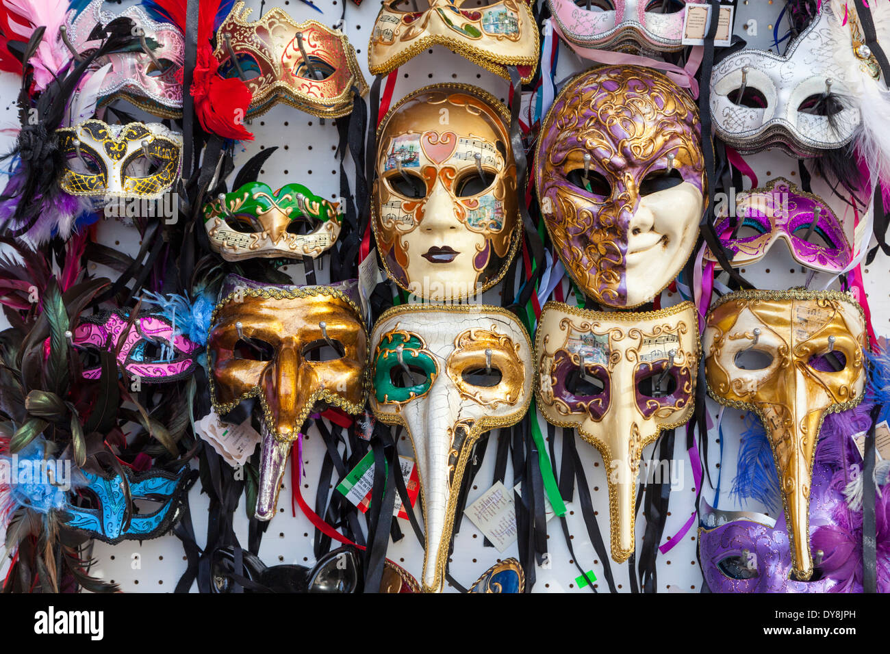 Venetian carnival masks on souvenir display stand Stock Photo