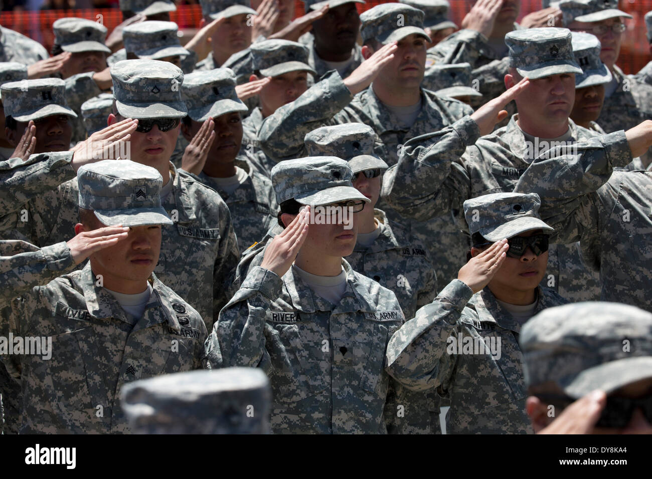 U.S. Army soldiers salute during memorial service for fellow soldiers killed in shooting at Fort Hood Army Post in Texas Stock Photo