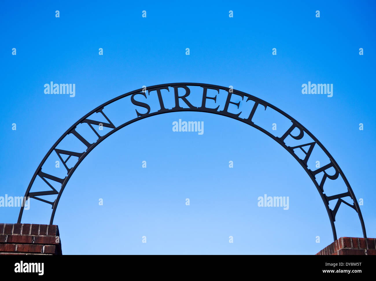 An arched sign for Main Street Park with vivid blue sky Stock Photo