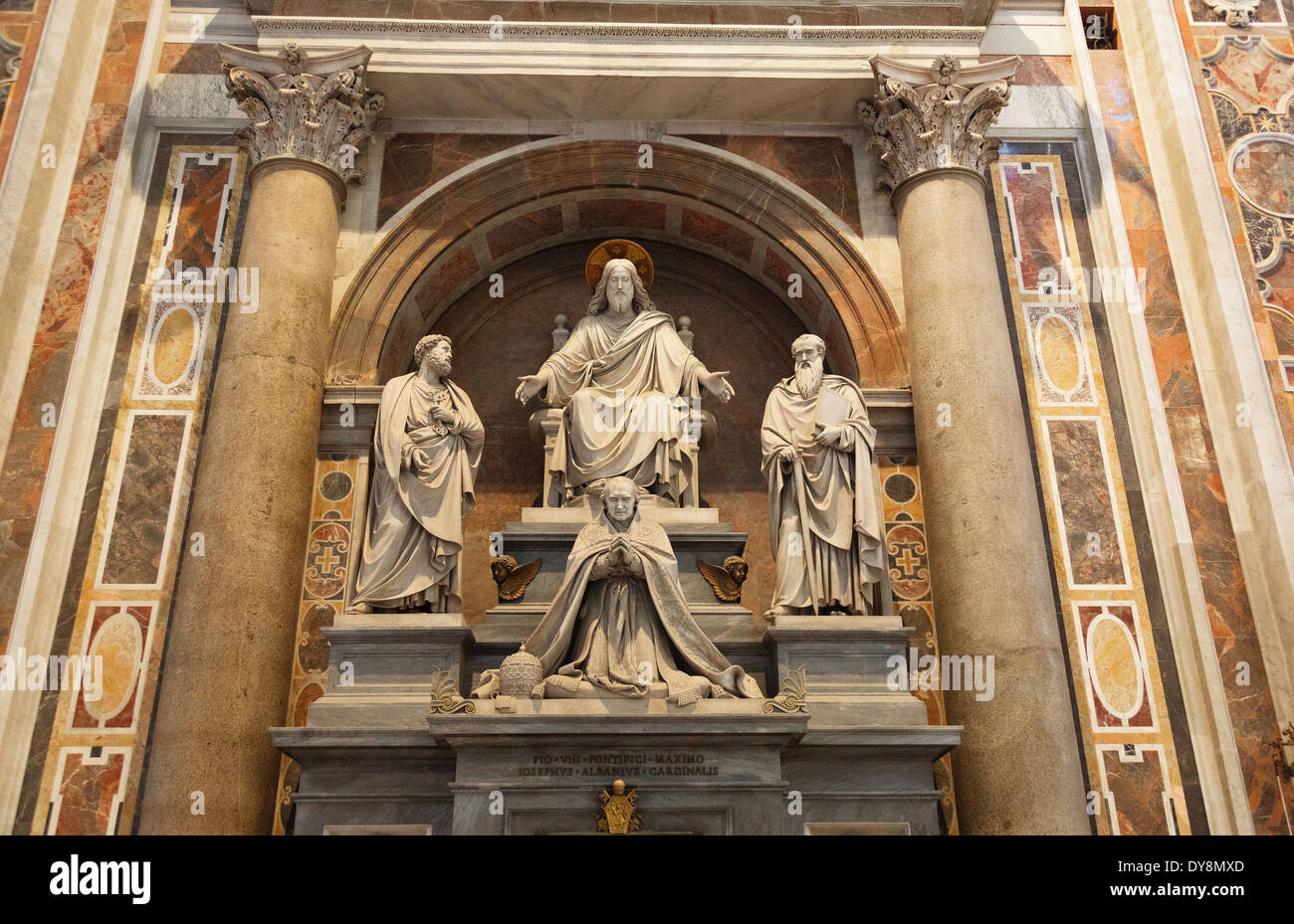 Spiritual statues between columns inside St. Peter's Basilica, the