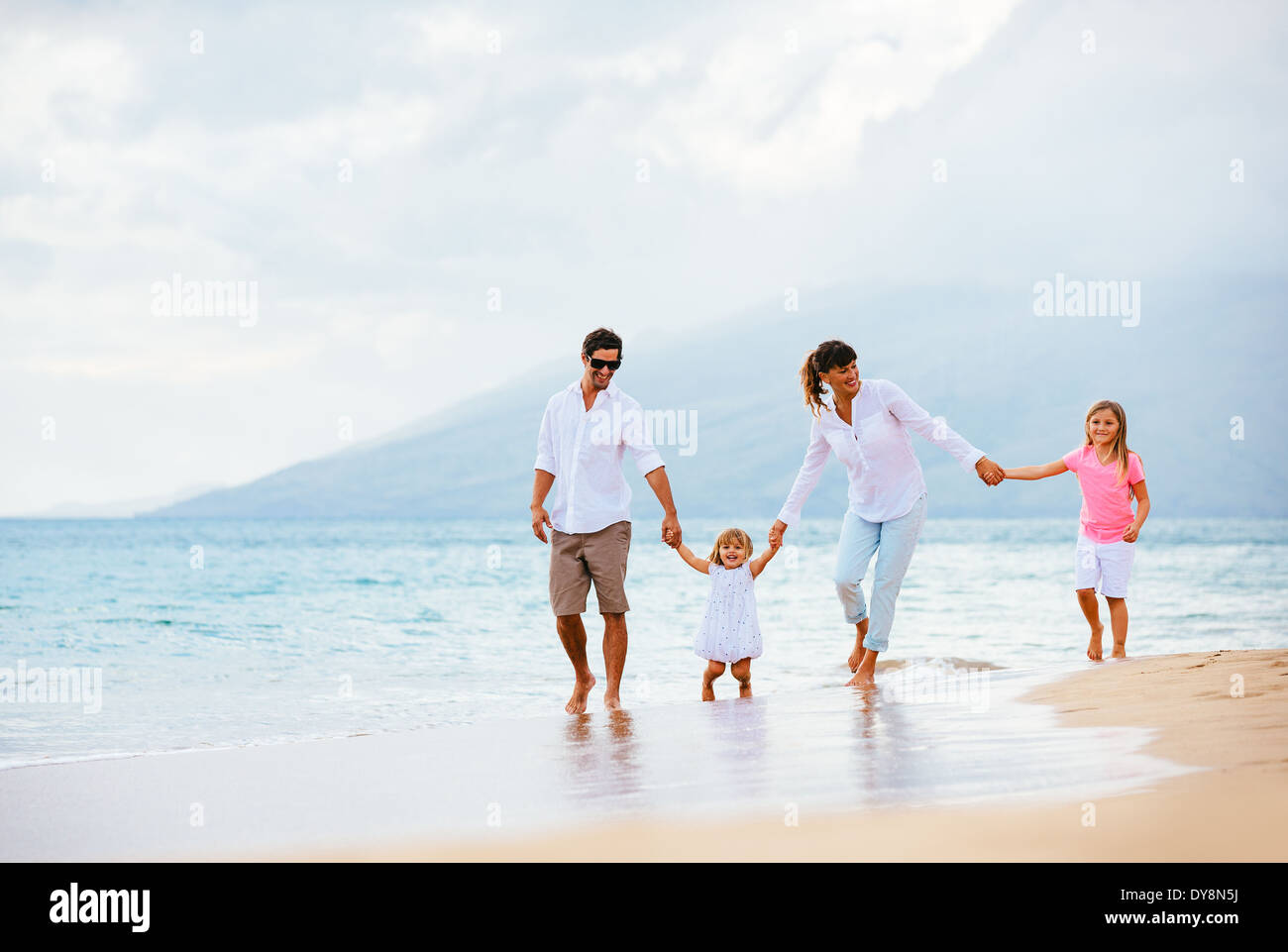Family beach walking happy summer hi-res stock photography and images ...