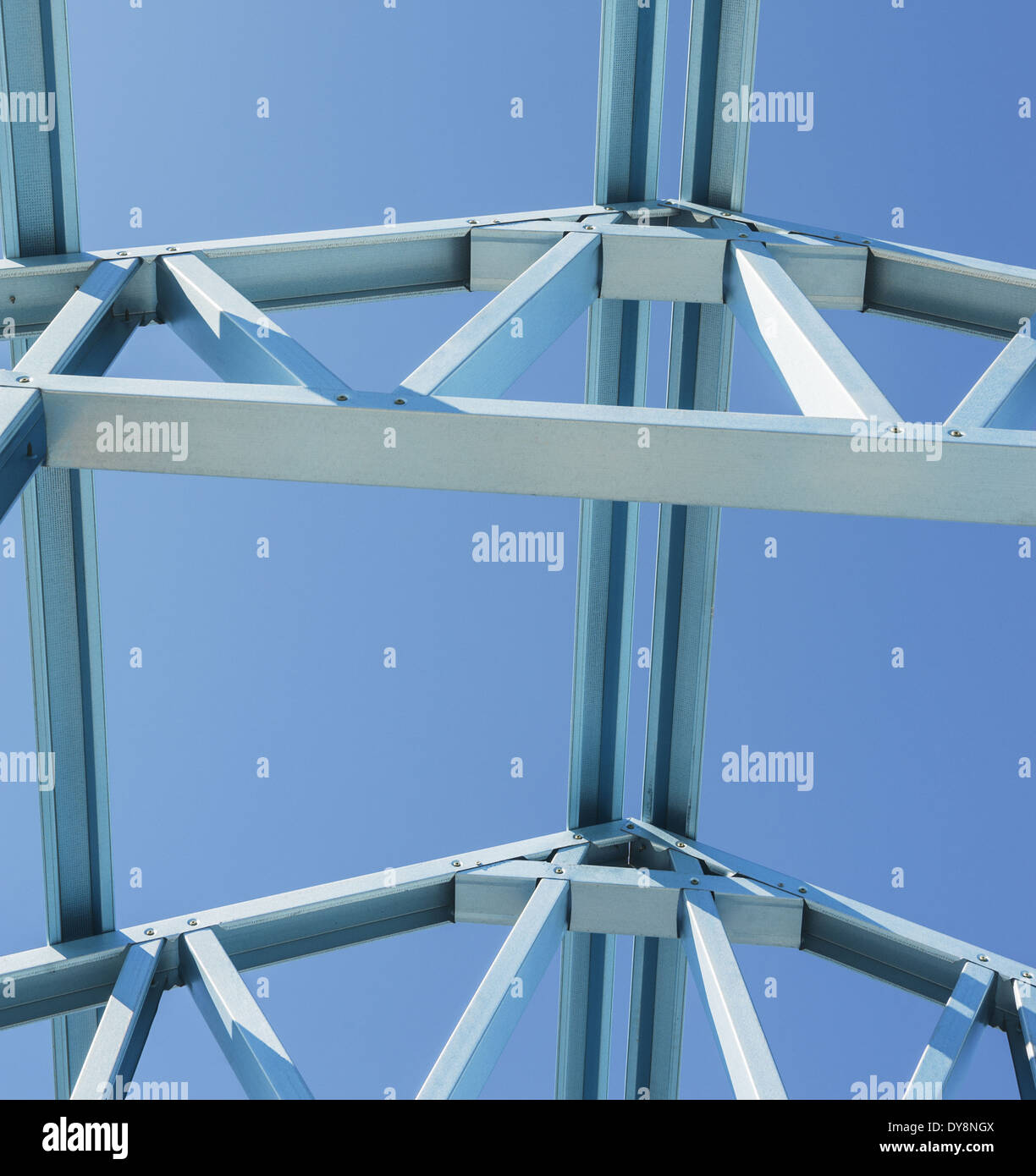 New residential construction home metal framing against a blue sky.Fragment. Stock Photo