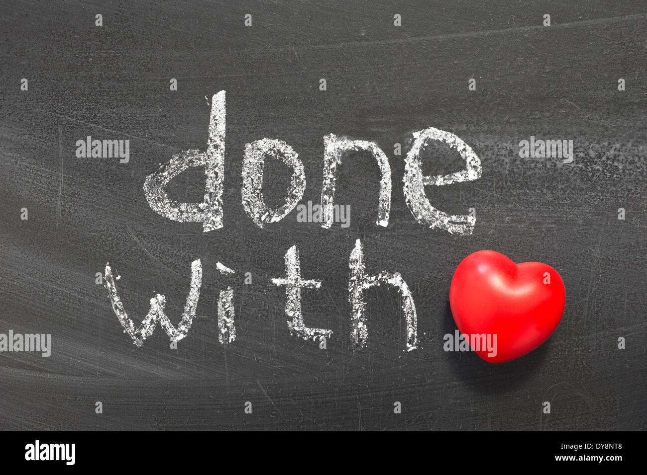 done with love phrase handwritten on school blackboard Stock Photo