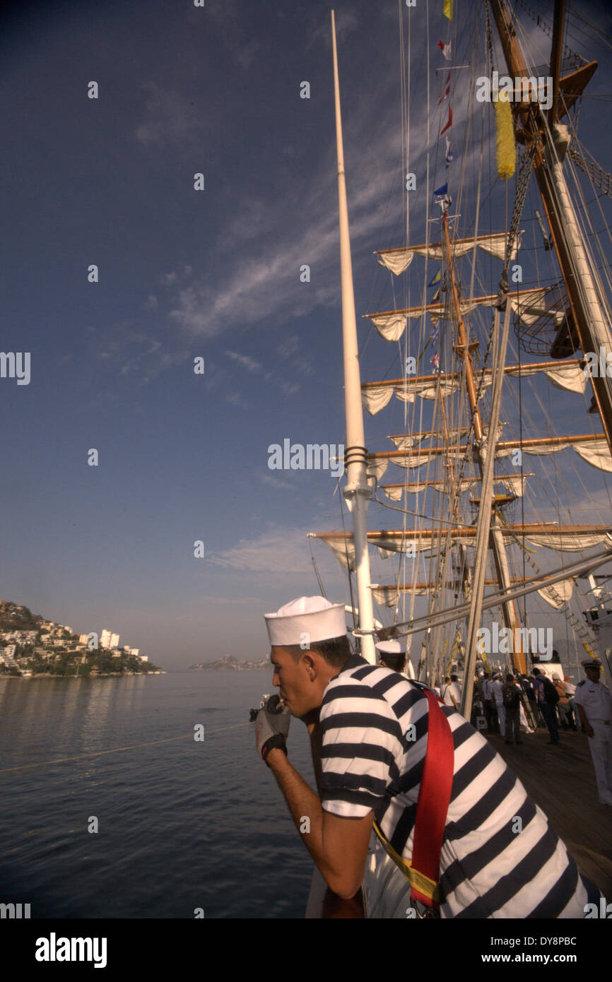 Acapulco, Mexico. 9th Apr, 2014. A crew member watches the water during a farewell ceremony for the Cuauhtemoc school ship of the Mexican Navy in the Acapulco port, Guerrero state, Mexico, April 9, 2014. The Cuauhtemoc school ship left the Acapulco port and started the project called 'Training Cruise America 2014' as part of the training of young marines. In this 228-day long project, the ship will visit 22 ports in 12 countries. © Abdel Meza/Xinhua/Alamy Live News Stock Photo