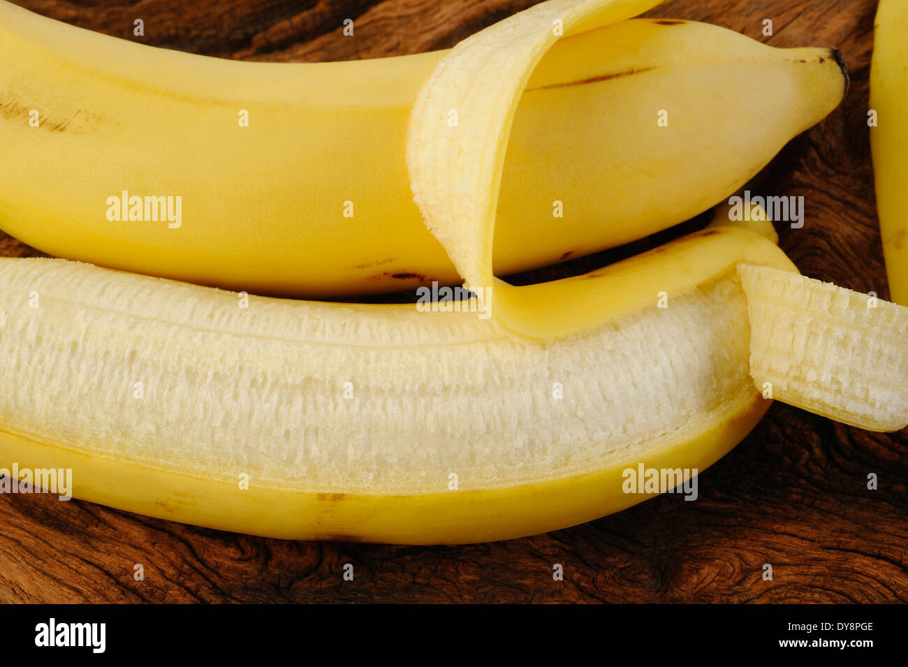 Fresh bananas on wooden background Stock Photo