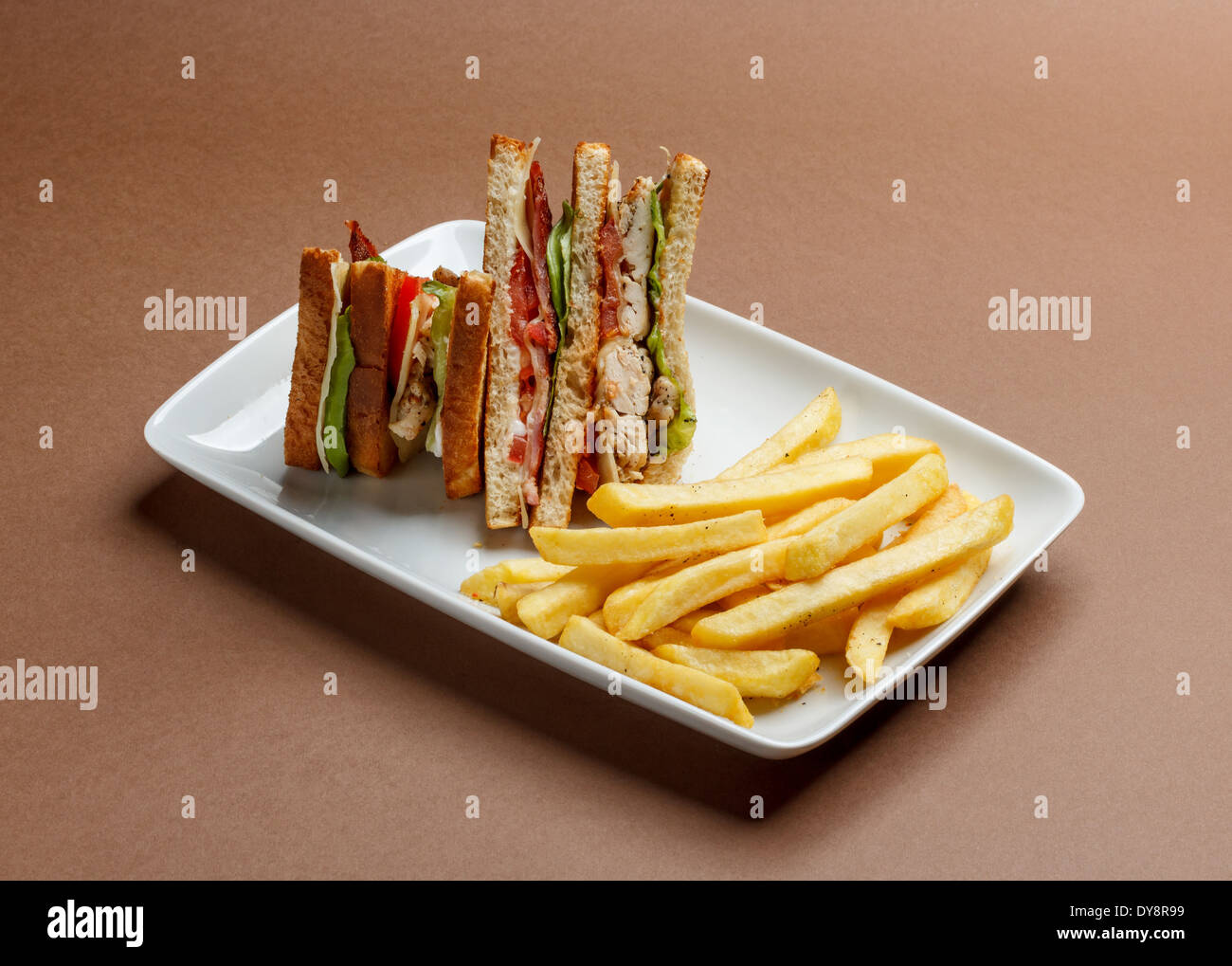 Delicious club sandwich with french fries Stock Photo Alamy