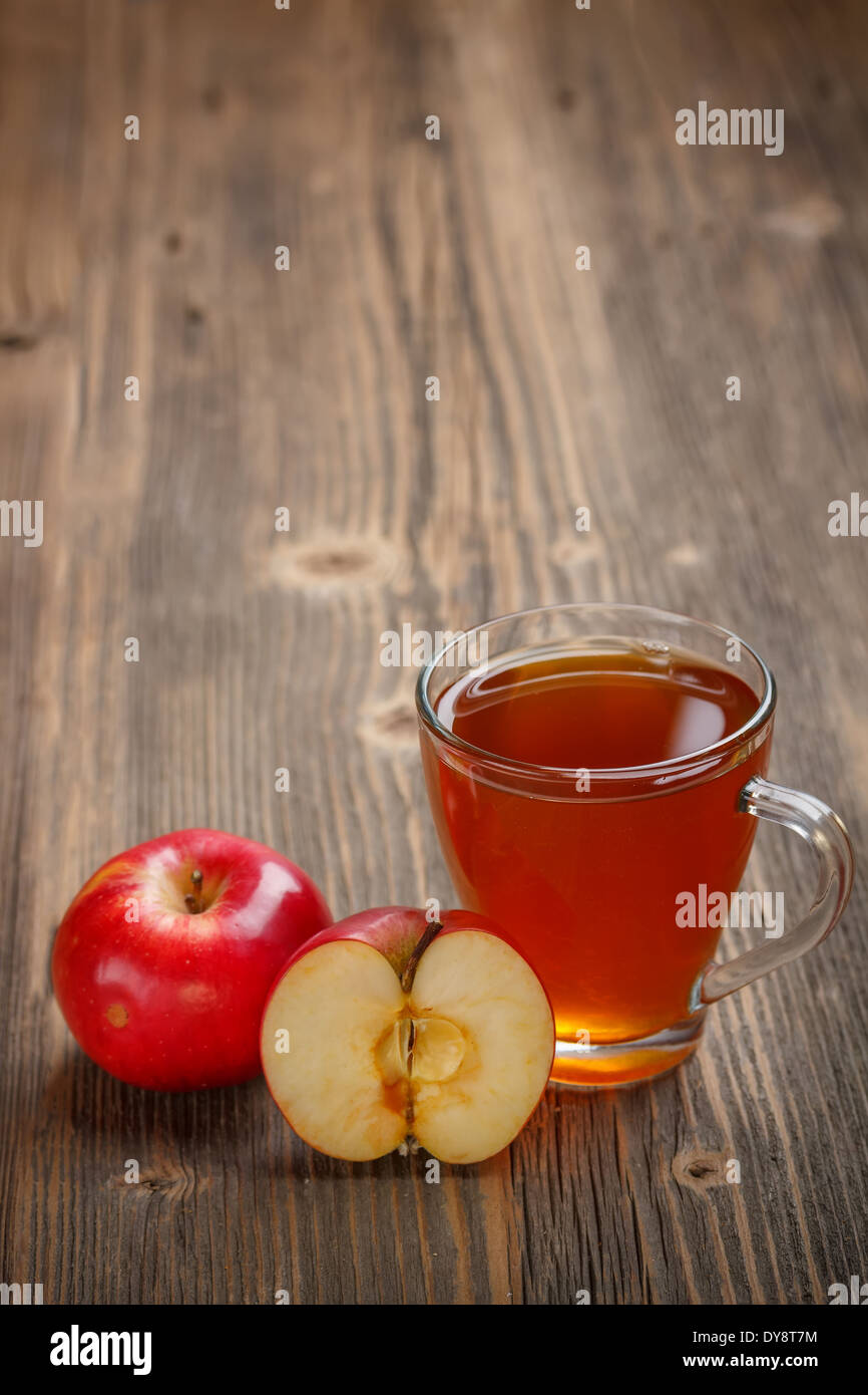 Apple juice in glass on wooden background Stock Photo