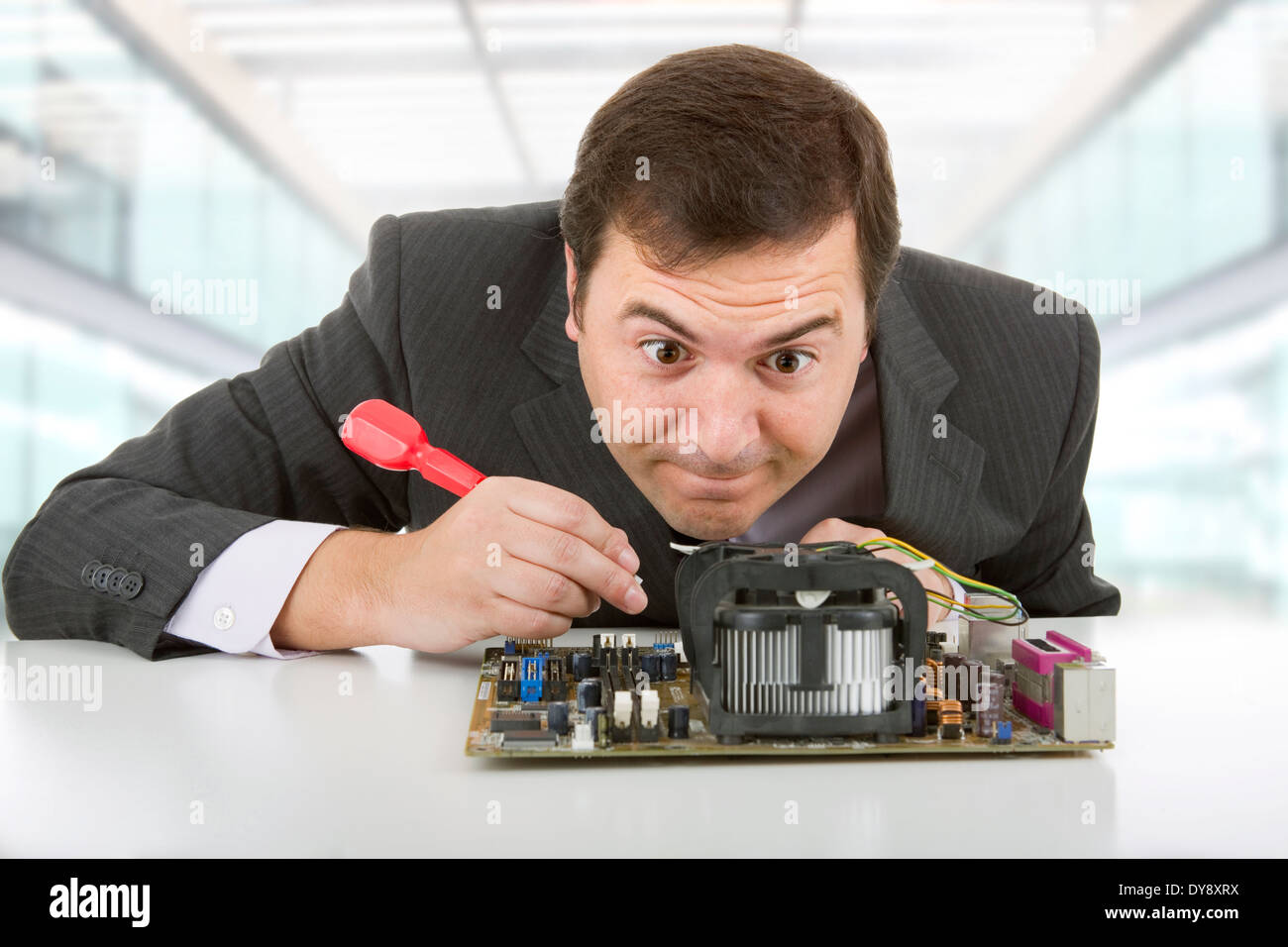 Computer Engineer working in a motherboard at the office Stock Photo