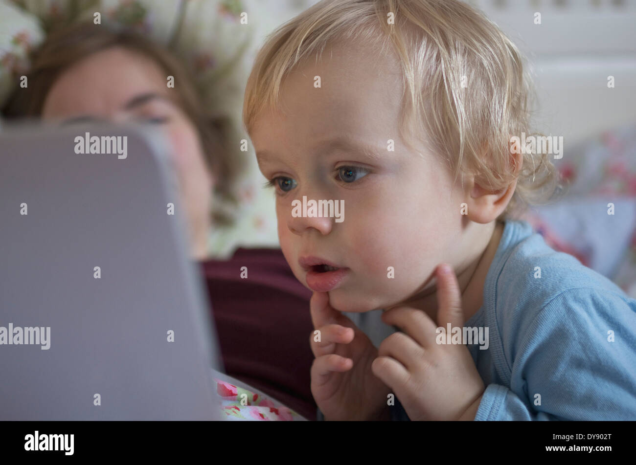 Toddler looking at digital tablet Stock Photo