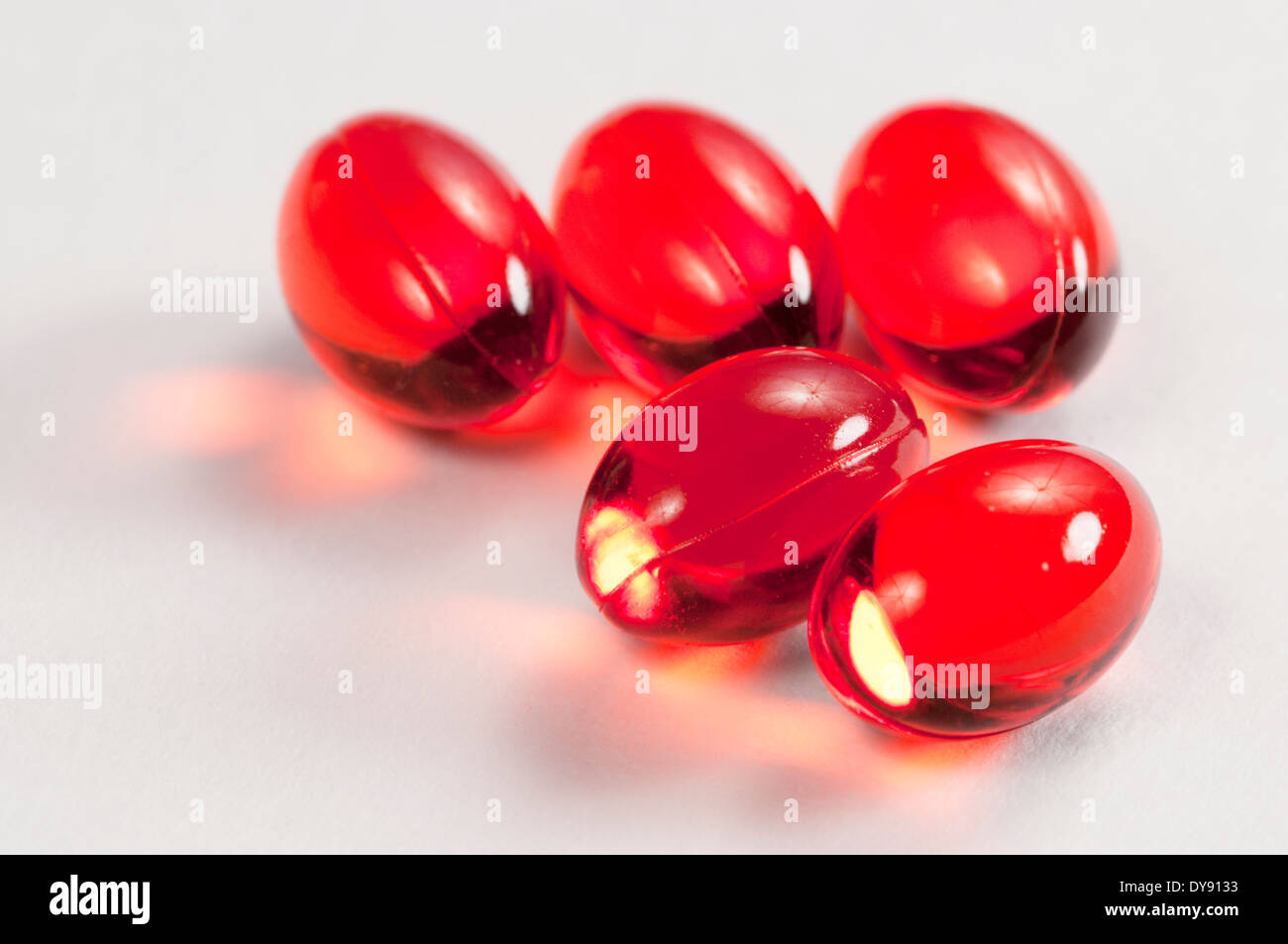 Red capsules over light hi-res stock photography and images - Alamy
