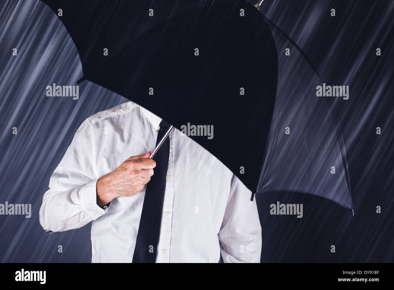 Businessman with black umbrella protecting from the rain. Business ...