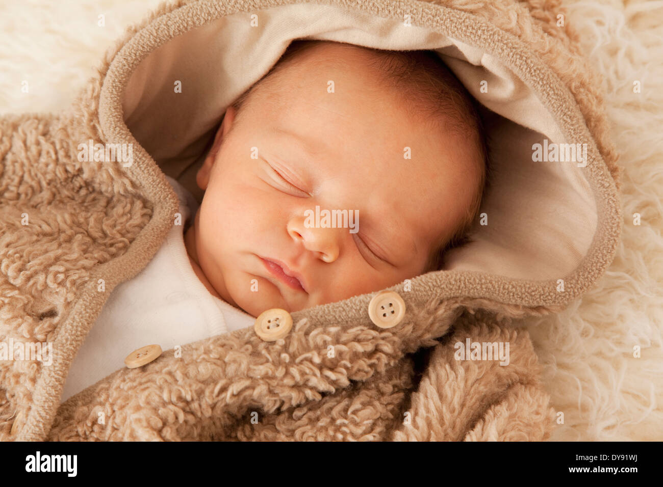 Newborn sleeping on sheepskin Stock Photo Alamy