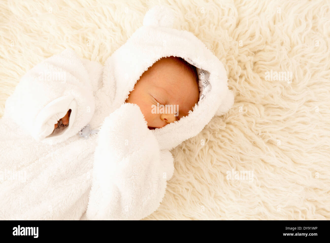 Newborn sleeping on sheepskin Stock Photo Alamy