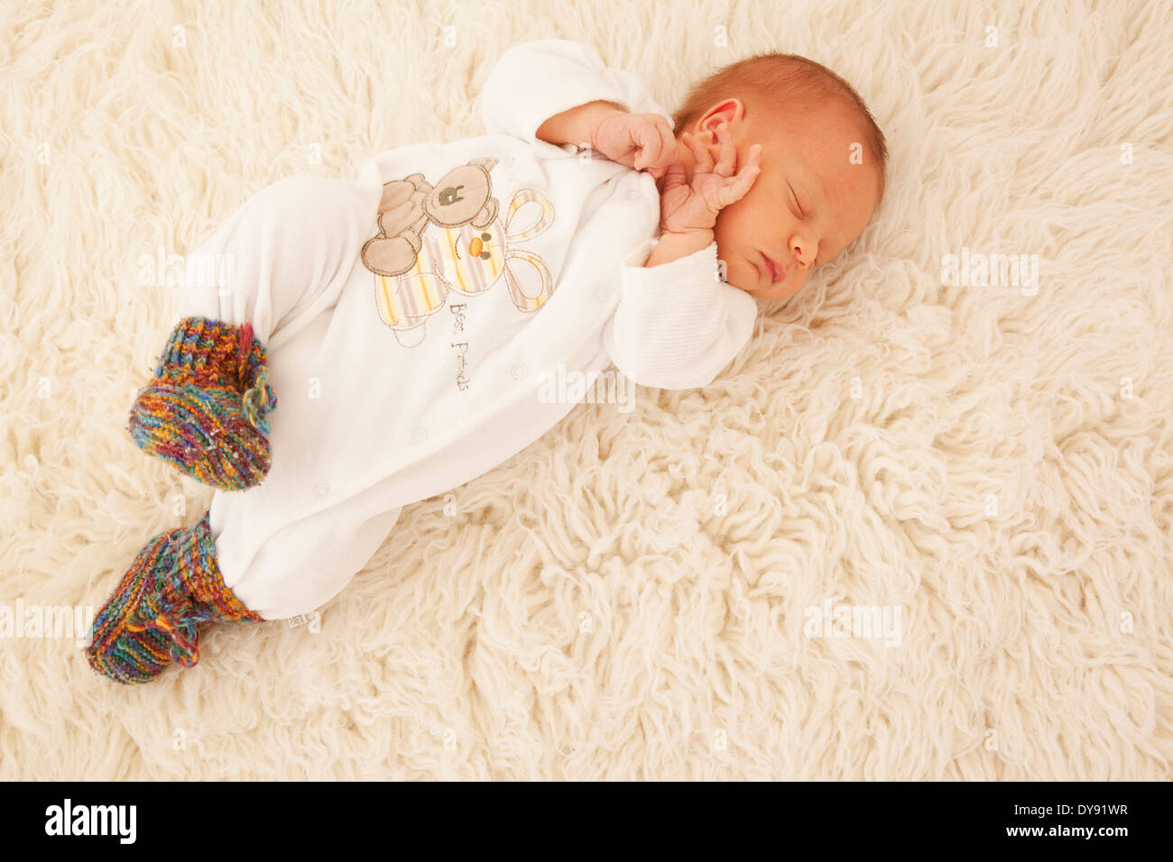 Newborn sleeping on sheepskin Stock Photo Alamy