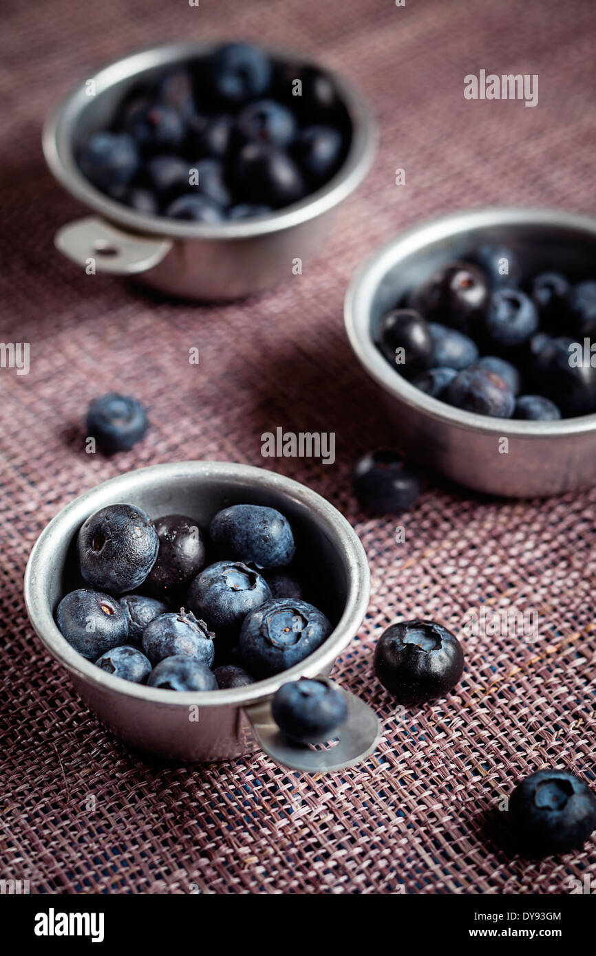 Three zinc bowls of blueberries on cloth Stock Photo Alamy