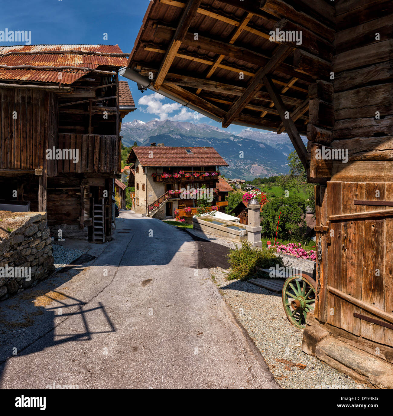 Old, wooden, farmhouses, chalets, town, village, summer, mountains, hills, Vex, Wallis, Valais, Switzerland, Europe, Stock Photo