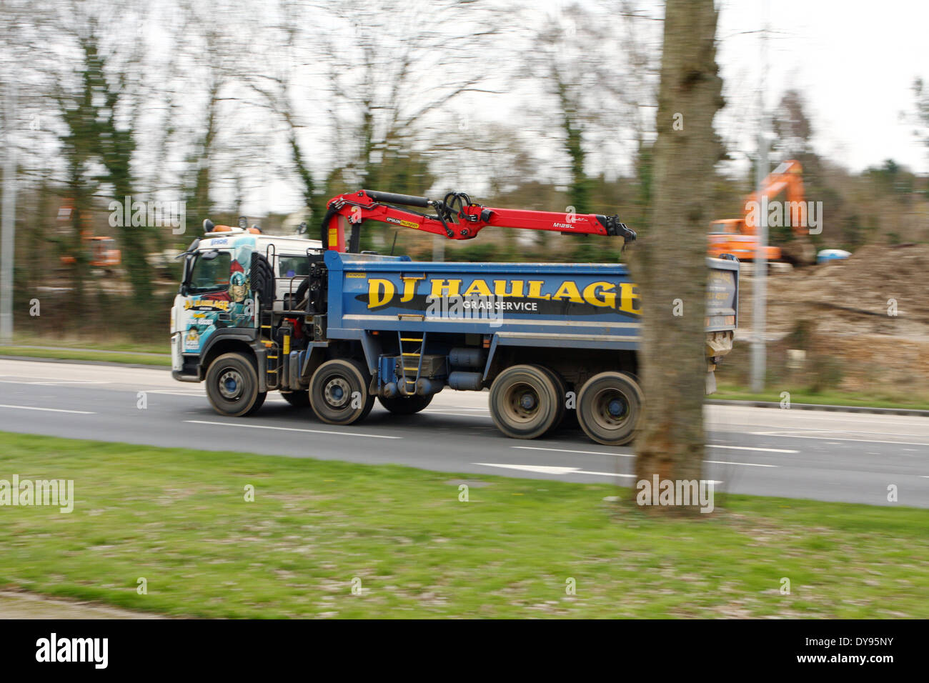 A DJ Haulage truck traveling along the A23 road in Coulsdon, Surrey, England Stock Photo