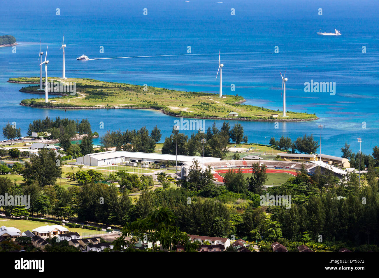 Seychelles, Mahe, Victoria, Soccer stadium and wind turbines Stock Photo