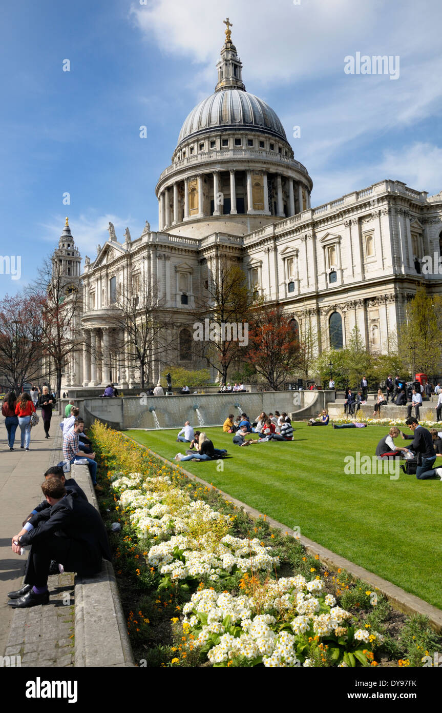 London, England, UK. People relaxing on the lawn of Festival Gardens, by St Paul's Cathedral Stock Photo