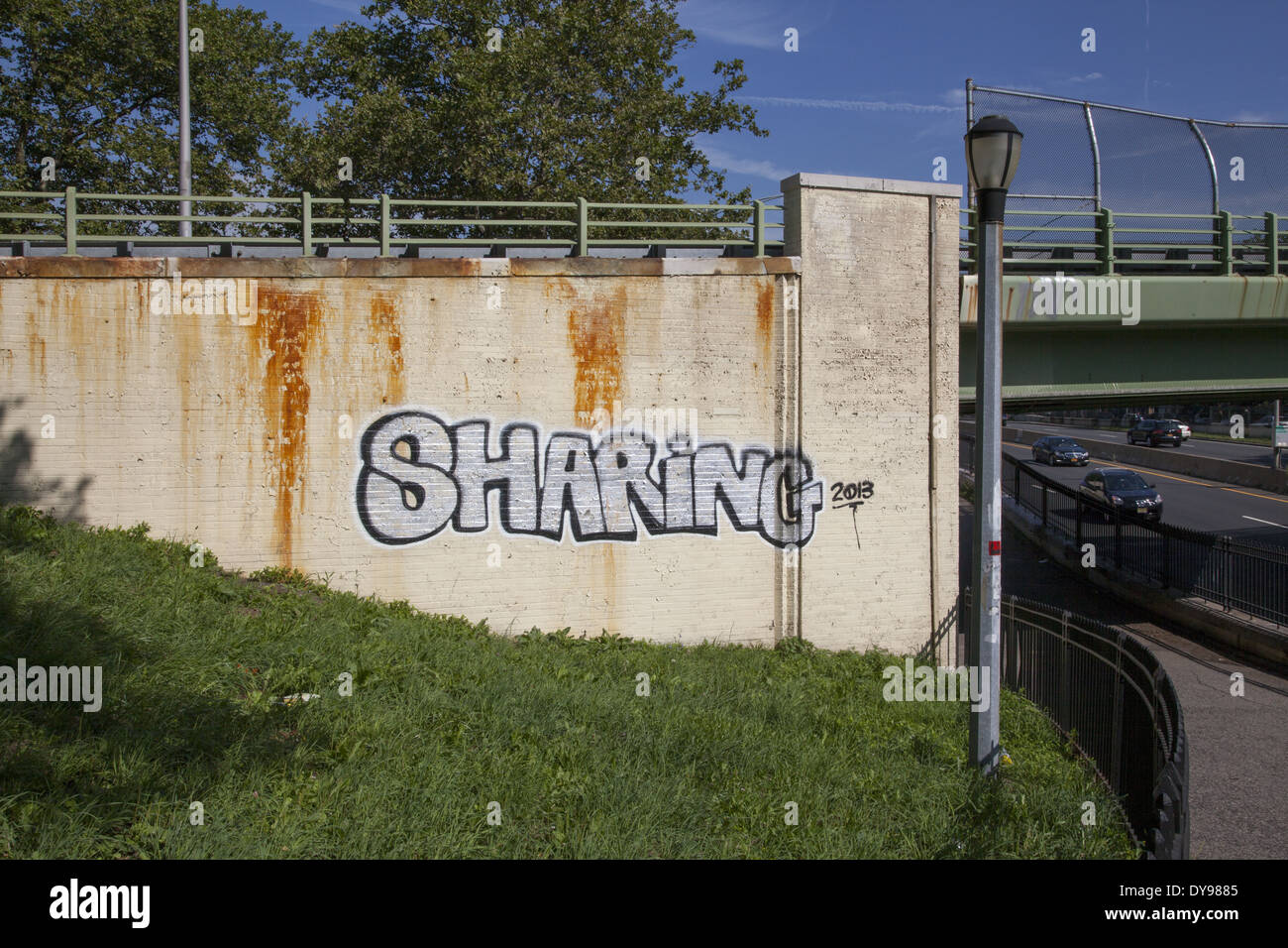 Graffiti type statement on a wall at a subway entrance in Brooklyn, NY. Stock Photo