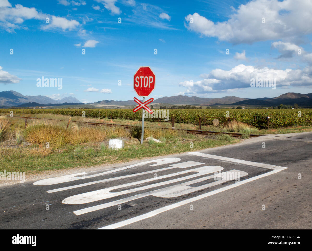 Stop sign at unmanned railway level crossing in the Western Cape South Africa Stock Photo