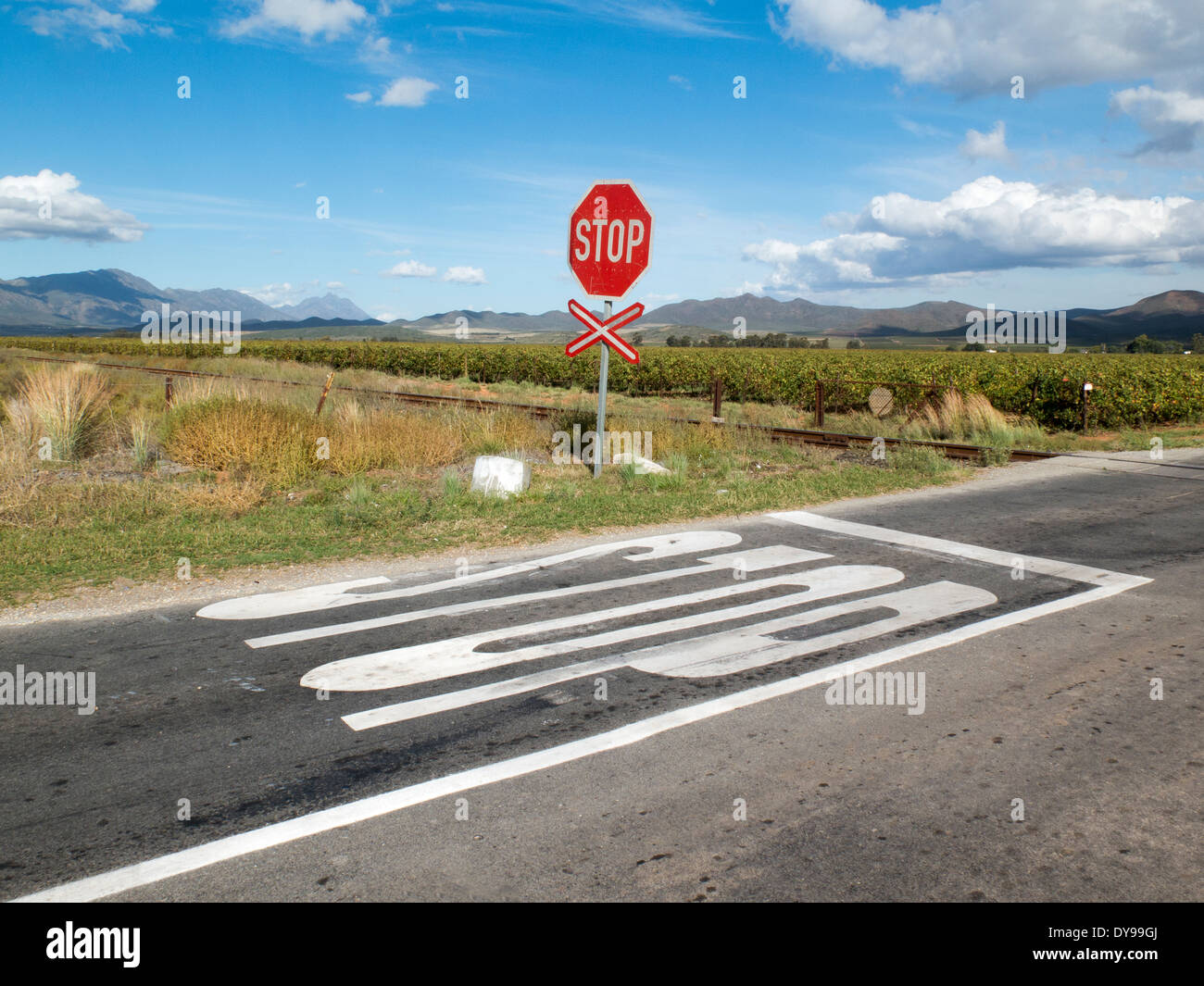 Stop sign at unmanned railway level crossing in the Western Cape South Africa Stock Photo