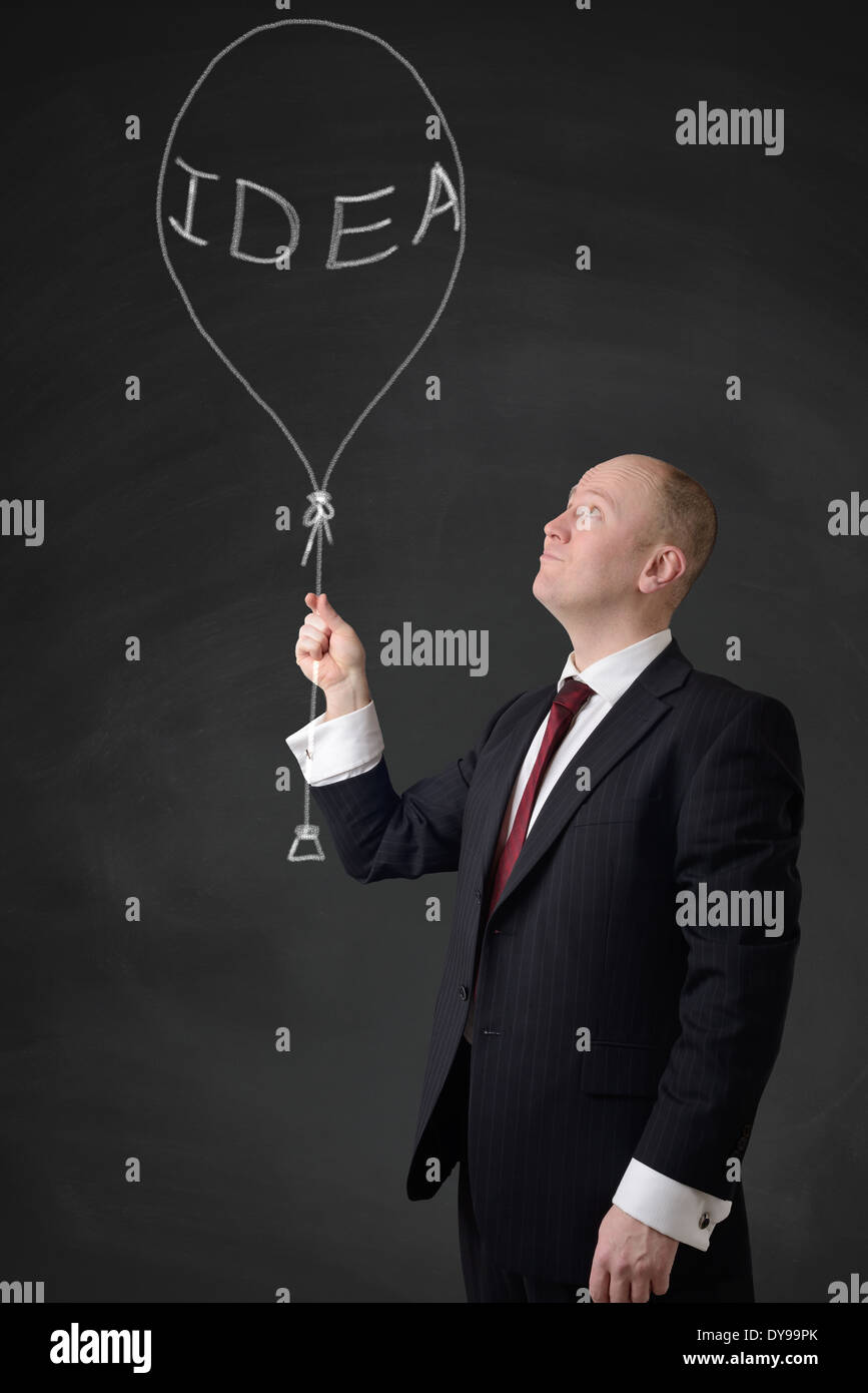 businessman holding a idea bubble Stock Photo