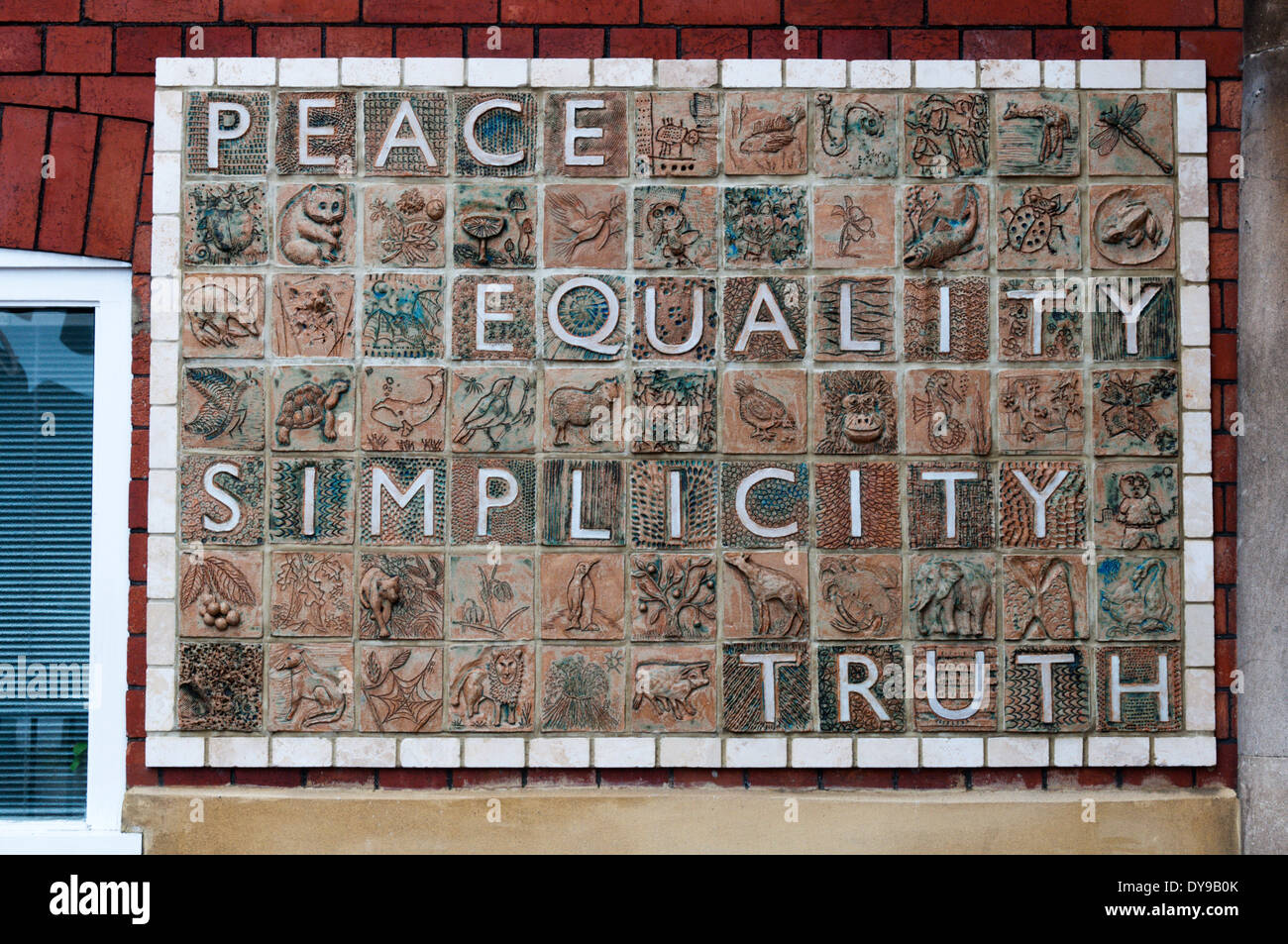 Tiles in the Horfield Quaker Meeting House Peace Garden in Bristol contain the Quaker principles. Stock Photo