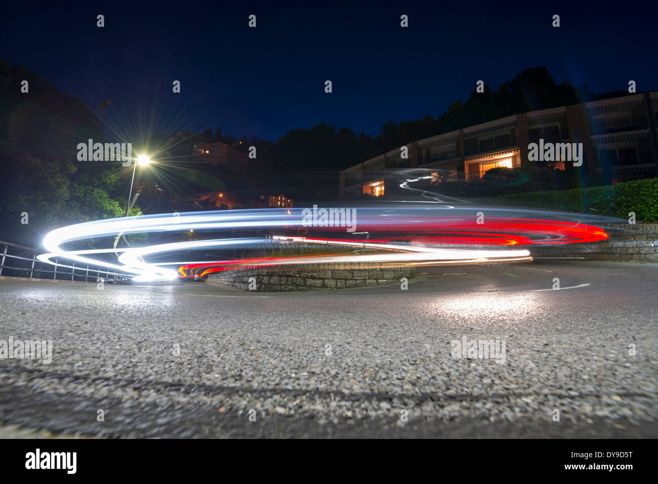Light trails over a road curve in ticino Switzerland, Europe, Stock Photo