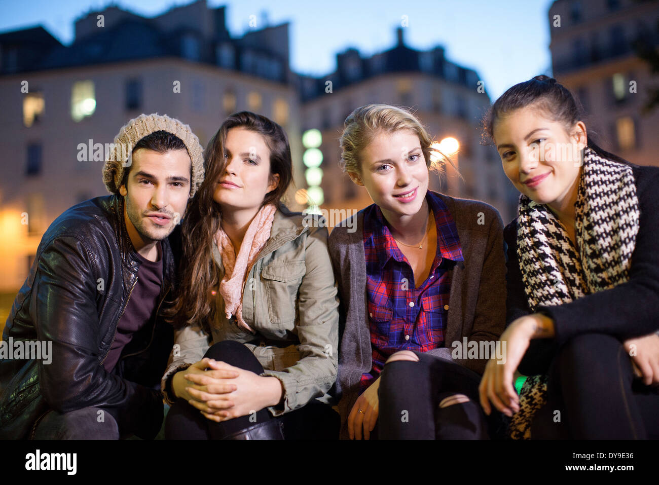 Friends hanging out together outdoors Stock Photo - Alamy