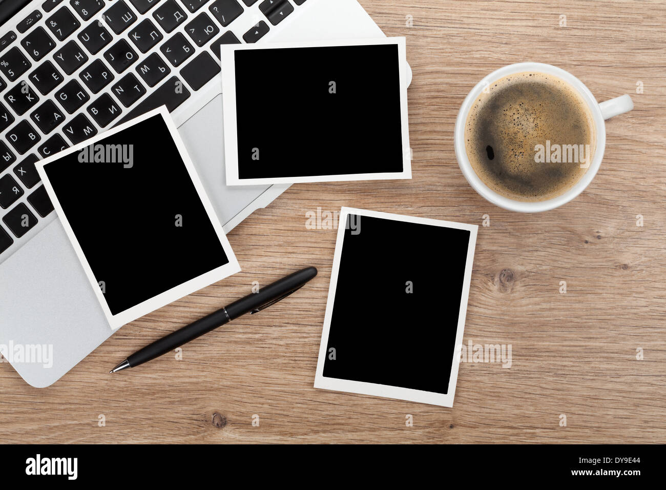 Blank instant photo frames over office table. View from above Stock Photo