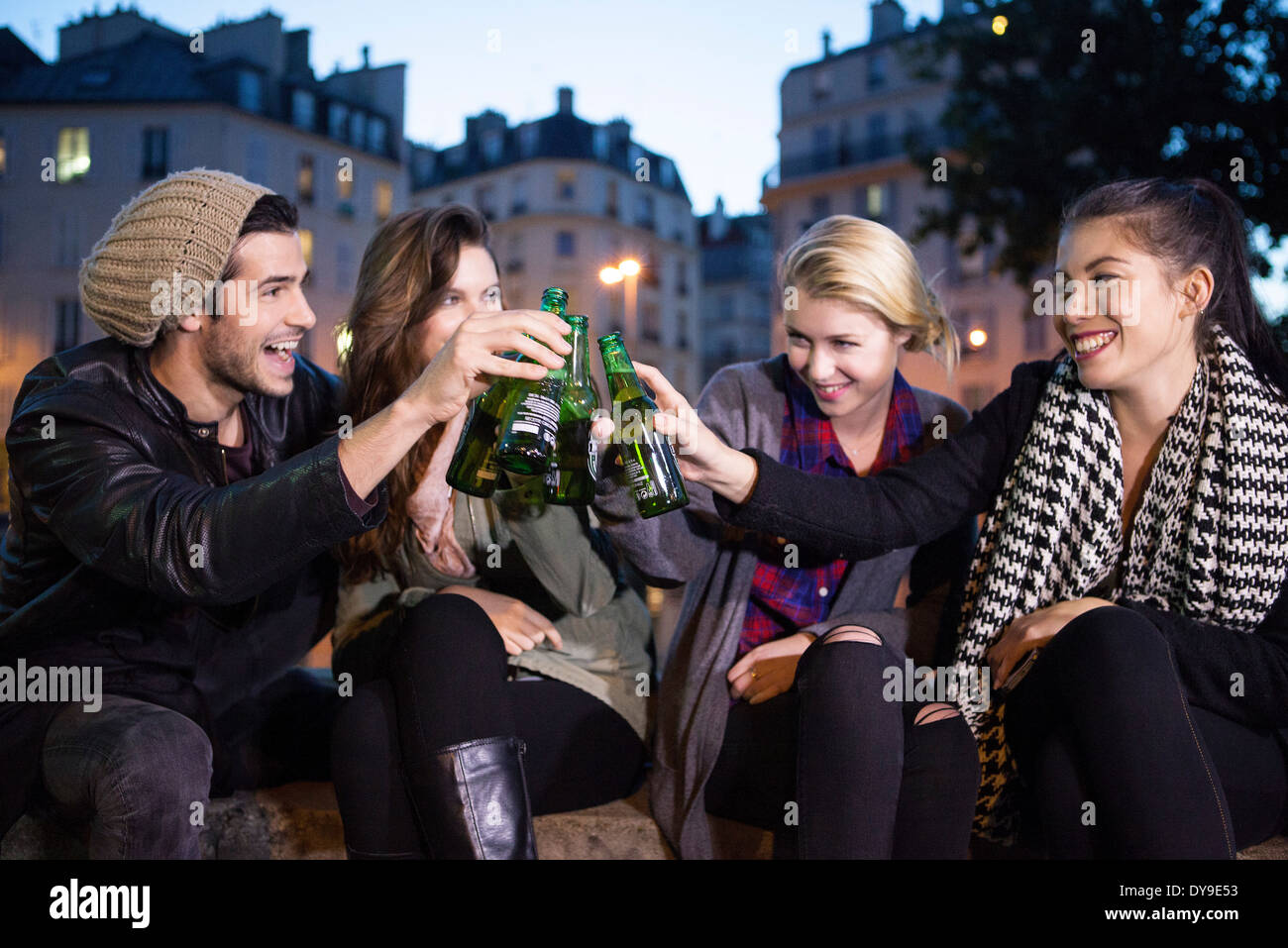 Friends celebrating together outdoors Stock Photo