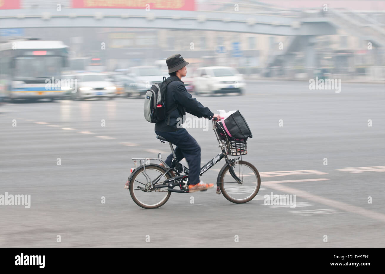 Young man on bike in Beijing, China Stock Photo